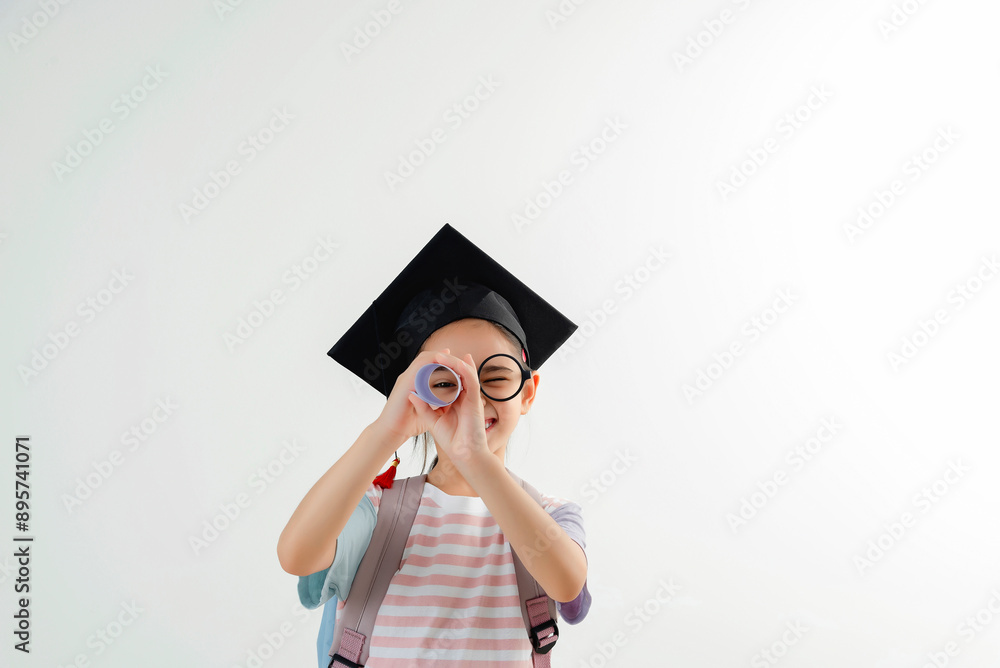 Happy Young Girl Wearing Graduation Cap and Glasses Holding Fist Up Happy Young Girl Wearing Graduation Cap and Glasses Holding Fist Up