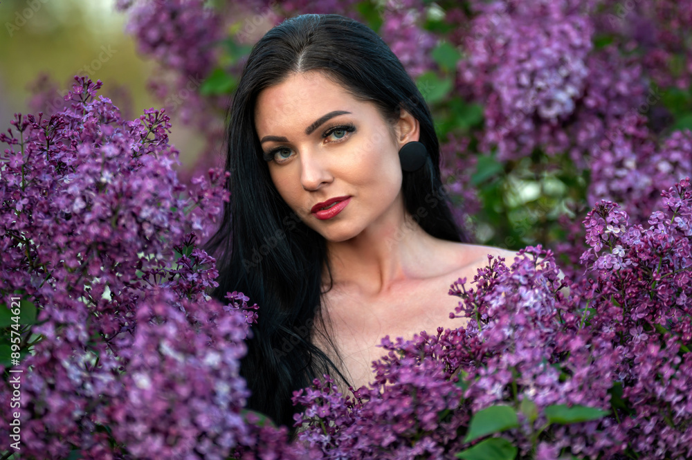 Woman among lilac blossoms. Shallow depth of feld Woman among lilac blossoms. Shallow depth of feld