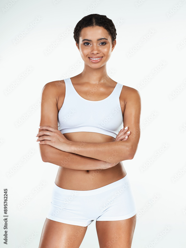 Arms crossed, woman and studio portrait in underwear for wellness, confidence and beauty. Model girl, body care and pride or fitness with cosmetics for health, glow and aesthetic by white background Arms crossed, woman and studio portrait in underwear for wellness, confidence and beauty. Model girl, body care and pride or fitness with cosmetics for health, glow and aesthetic by white background