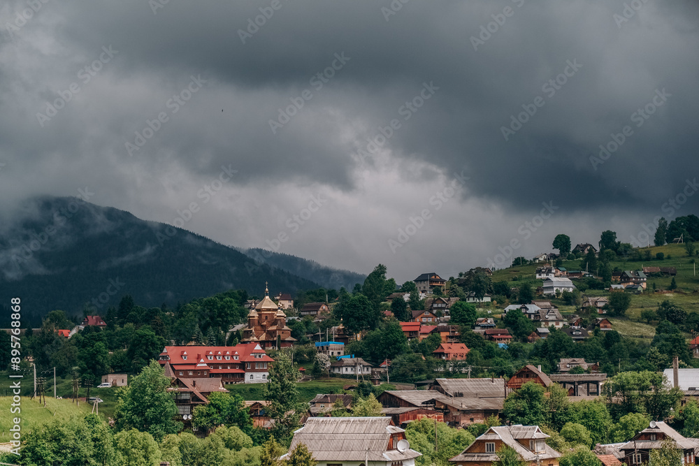 Fototapeta premium Traveling to the mountains in summer. Summer holiday in an authentic mountain village in summer.