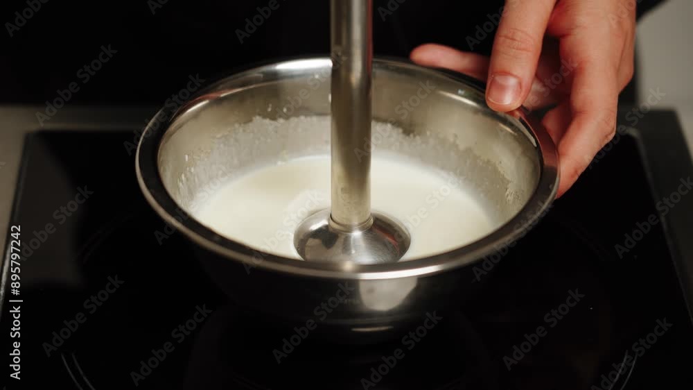 The pastry chef prepares ganache for the cake.Confectionery concept.Ganache The pastry chef prepares ganache for the cake.Confectionery concept.Ganache