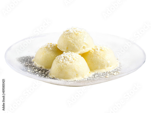 Ras Malai cottage cheese dumplings in sweetened milk served on a transparent glass dish creamy