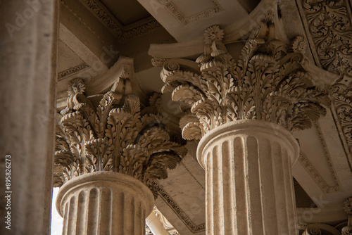 Ornate Classical Columns of Antique Design with detailed Corinthian Capitals Decorated with intricate Leaf pattern. Architectural elements Historic building characterized exquisite craftsmanship