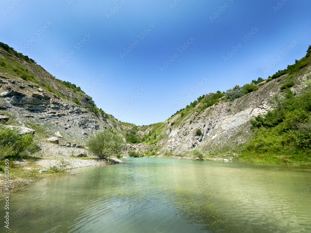 A wonderful landscape in the Carpathian mountains with a view of the lake between the rocks in sunny weather A wonderful landscape in the Carpathian mountains with a view of the lake between the rocks in sunny weather