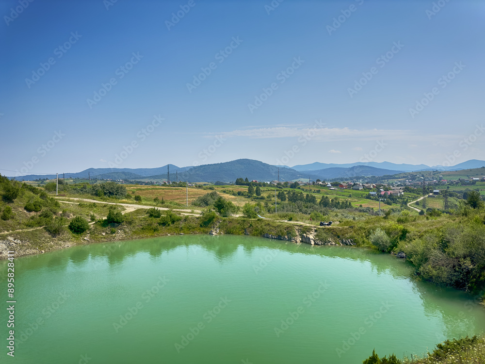 A wonderful landscape in the Carpathian mountains with a view of the lake between the rocks in sunny weather A wonderful landscape in the Carpathian mountains with a view of the lake between the rocks in sunny weather