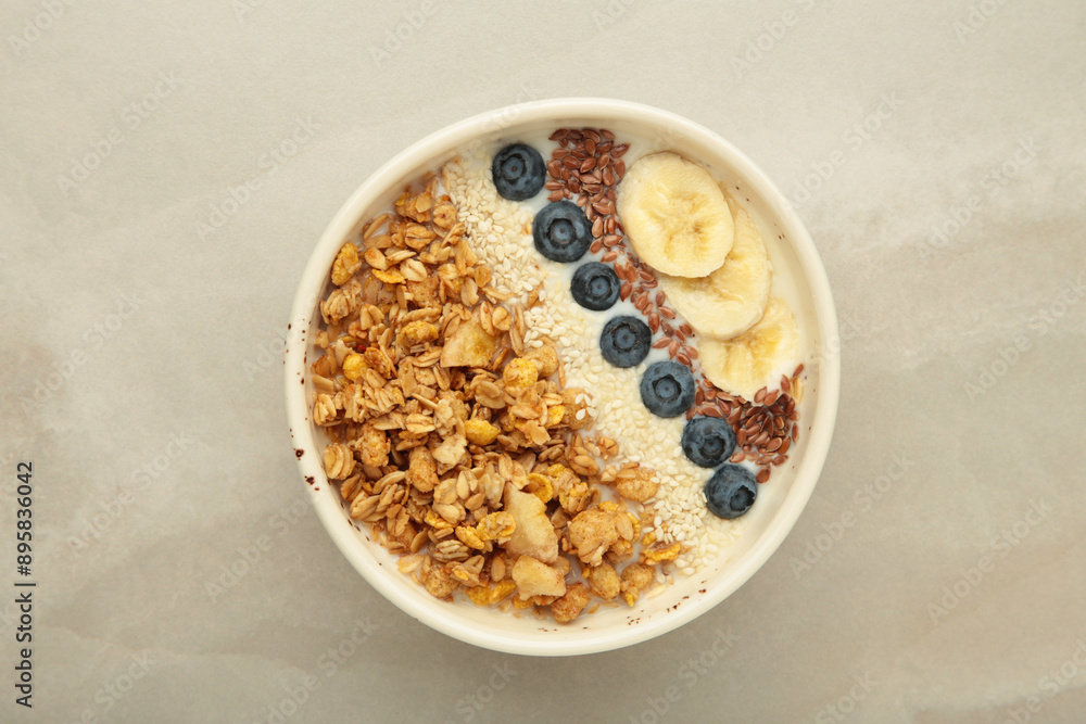 Granola with fresh summer berries in a bowl on light background. Concept of healthy breakfast food Granola with fresh summer berries in a bowl on light background. Concept of healthy breakfast food