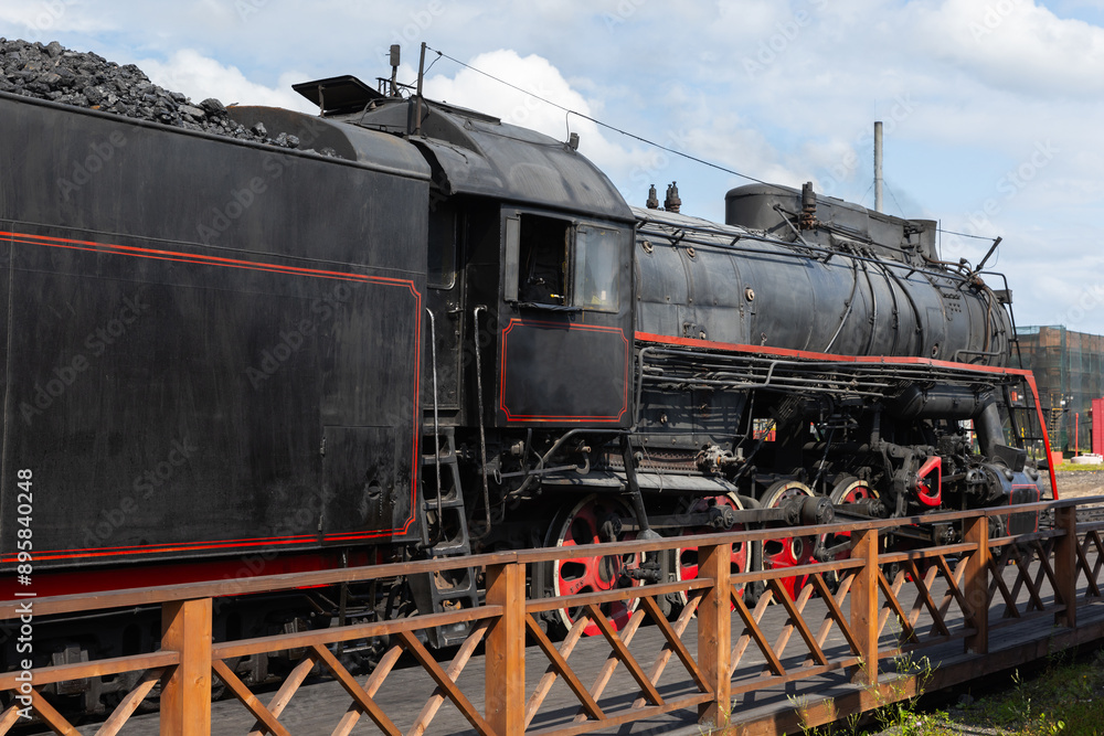 Naklejka premium Vintage black steam locomotive with red details