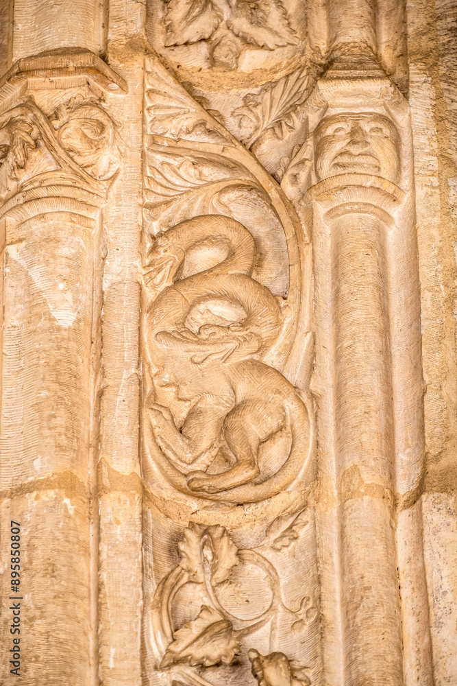 Cat with double-headed dragon head, cloister of the monastery of San Juan de los Reyes, Toledo, Castilla-La Mancha, Spain Cat with double-headed dragon head, cloister of the monastery of San Juan de los Reyes, Toledo, Castilla-La Mancha, Spain