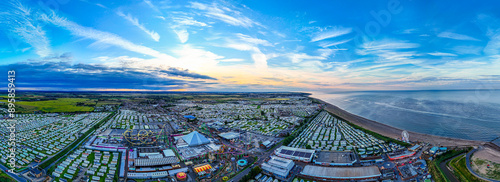 Sunset Aerial Panoramic View of the UK Seaside Ingoldmells, a busy tourist town with something for everyone, from stunning campsites to a sunset to die for, showcases the beauty of a serene sunset photo