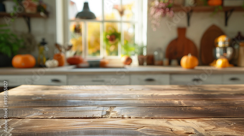 Autumn kitchen scene with a wooden table and decorative pumpkins, leaving room for copy.