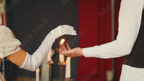 Hands close-up body part romantic couple in love, man and woman go to medieval ball. king invites queen to waltz dance, prince guy gives hand to sexy princess girl. Vintage white dress gloves art 4k