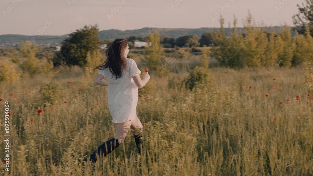 young attractive woman enjoying the sunset outdoors in poppy field young attractive woman enjoying the sunset outdoors in poppy field