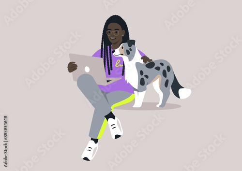 A young character sits on the floor and works on a laptop, A faithful merle dog sits beside them, a comforting presence in their day