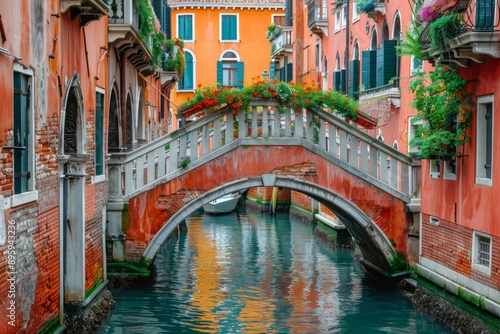 Stone bridge over a canal in an old city.