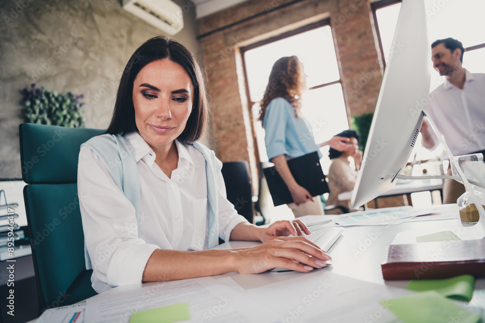 Photo of pretty female read documents sit table teamwork young people working together employees industrial open space interior workplace Photo of pretty female read documents sit table teamwork young people working together employees industrial open space interior workplace