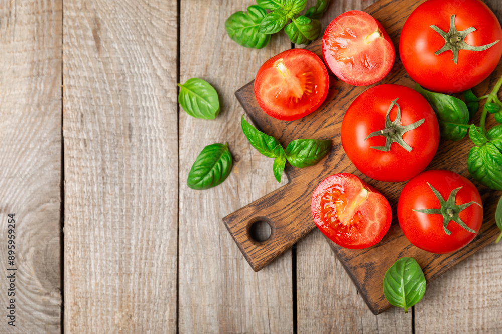 Fresh cherry tomatoes and fresh green basil on a textured background. Tomato sauce. Vegan. Ingredients for salad. Organic food. Place for text. Copy space. Fresh cherry tomatoes and fresh green basil on a textured background. Tomato sauce. Vegan. Ingredients for salad. Organic food. Place for text. Copy space.