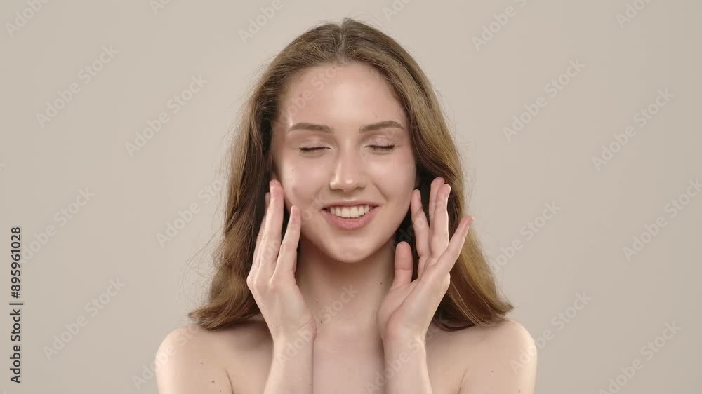 Young woman posing at camera touching smooth skin on face and shoulders area, isolated on white background. Natural beauty skin care concept Young woman posing at camera touching smooth skin on face and shoulders area, isolated on white background. Natural beauty skin care concept