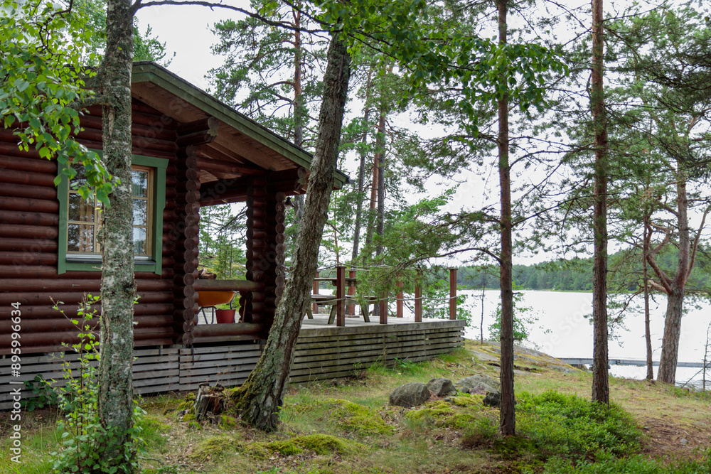 Finnish summer sauna house in the archipelago, island with pine forest in Finland near the Baltic sea Finnish summer sauna house in the archipelago, island with pine forest in Finland near the Baltic sea