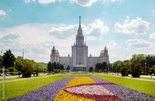 The building of Moscow State University with beautiful flower beds on a clear sunny day. Sights of Moscow, World tourism.