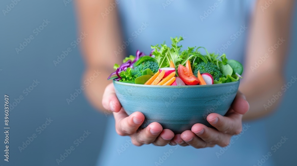 Fresh Salad in a Bowl Held by Hands. Fresh Salad in a Bowl Held by Hands.