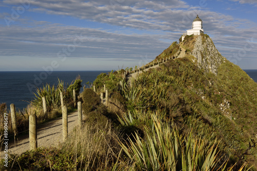 panoramic view to the Nugget Point Lighthouse, located in the Catlins area on the Southern Island Coast of New Zealand, Otago region photo