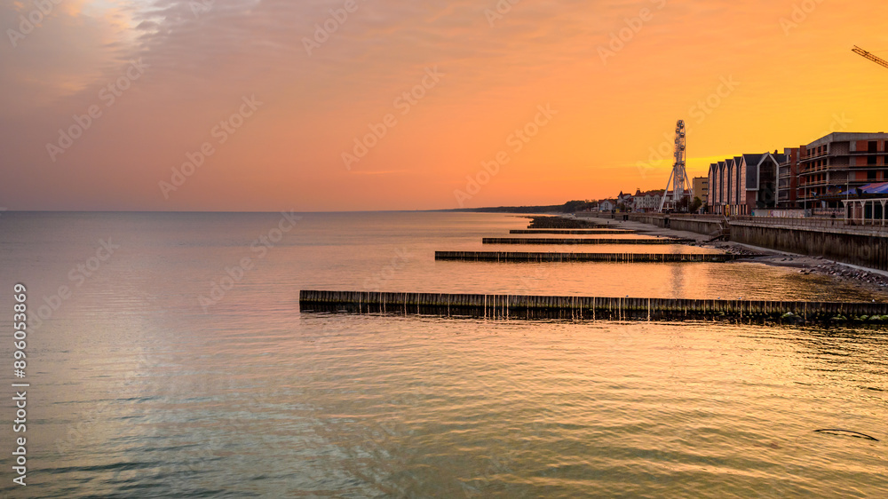 View of promenade of resort town of Zelenogradsk on the coast of Baltic sea at sunrise. Russia