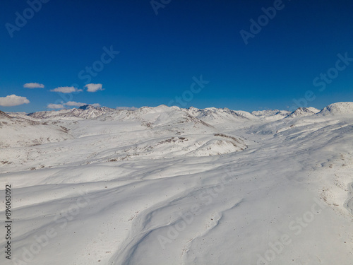 Aerial view of snow-covered mountains in Deosai National Park, Kharmang District, Astore District, Pakistan. photo