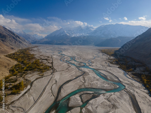 Aerial view of majestic mountains, tranquil valley, and glacier at Machulo La, Central Karakoram National Park, Pakistan. photo