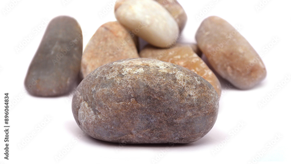 Pebbles piled on white background Pebbles piled on white background