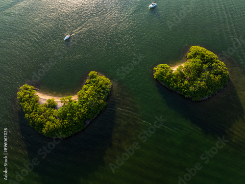 Aerial view of serene islands and boats on calm Biscayne Bay, Bay Harbor Islands, Florida, United States. photo