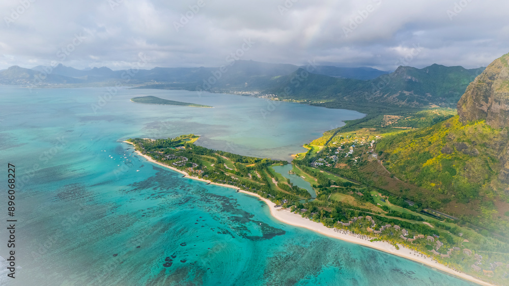 Aerial view of tropical paradise with clear water and lush green mountains, Le Morne Brabant, Mauritius. Aerial view of tropical paradise with clear water and lush green mountains, Le Morne Brabant, Mauritius.