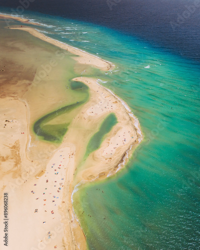 Aerial view of beautiful beach with turquoise water at Playa de Sotavento de Jandia, Pajara, Fuerteventura, Canary Islands, Spain. photo