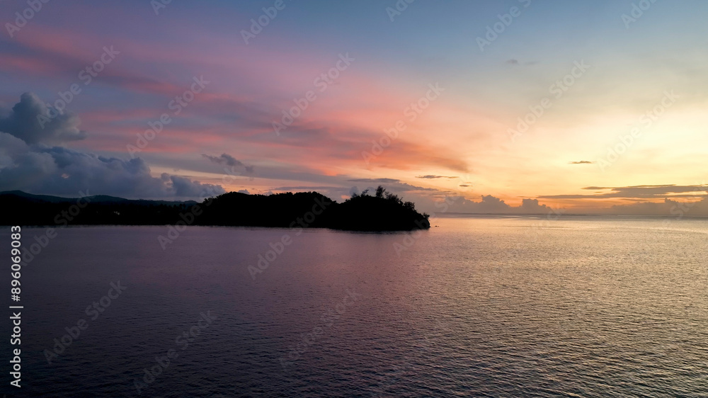 Aerial view of serene sunrise over tropical island paradise, Fiji. Aerial view of serene sunrise over tropical island paradise, Fiji.