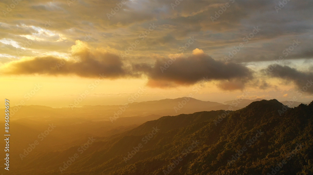 Aerial view of sunset over moody clouds and majestic mountains, Minca, Colombia. Aerial view of sunset over moody clouds and majestic mountains, Minca, Colombia.