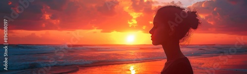 Sunset on a beach with a woman looking out at the ocean, Portrait, Banner