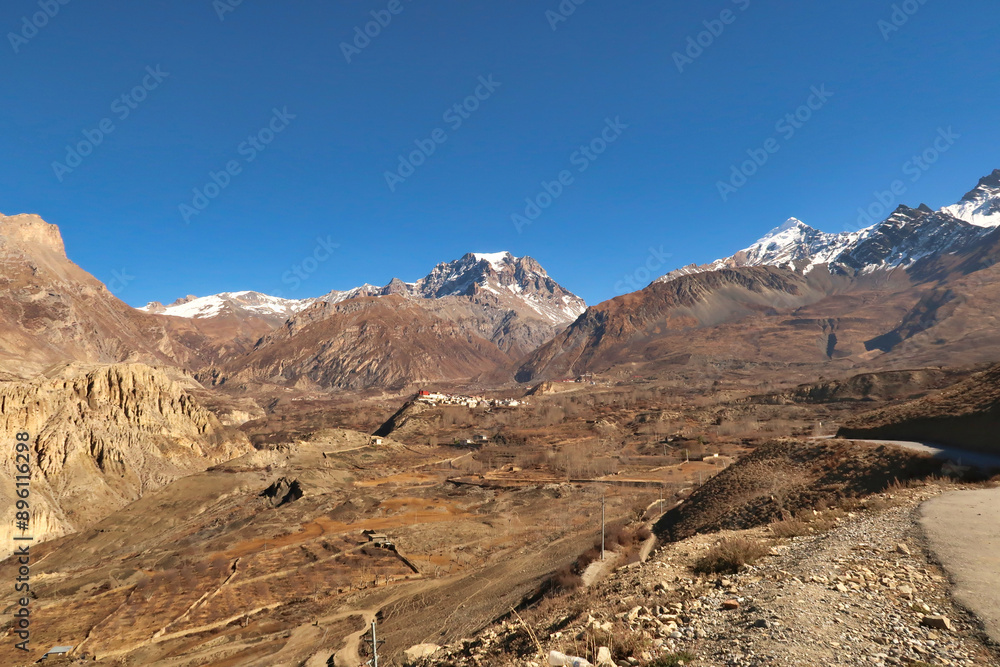 View from the road onto farmland, the rural landscape below the traditional village of Jharkot in front of Thorong, Thorung, La Pass, close to Muktinath, Annapurna Circuit Trek, Nepal View from the road onto farmland, the rural landscape below the traditional village of Jharkot in front of Thorong, Thorung, La Pass, close to Muktinath, Annapurna Circuit Trek, Nepal