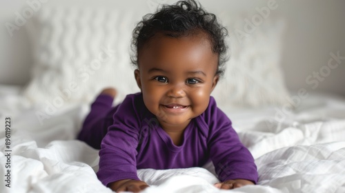 The adorable baby on bed