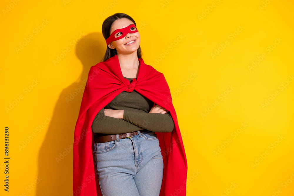 Photo portrait of pretty teenager girl look empty space superman confident wear trendy khaki outfit isolated on yellow color background Photo portrait of pretty teenager girl look empty space superman confident wear trendy khaki outfit isolated on yellow color background