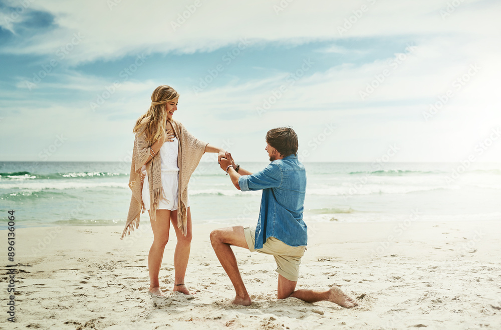 Marriage, proposal and couple with love at beach for engagement, happiness and surprise on vacation. Blue sky, waves and man with question on knee for romantic gesture, support and holiday in Venice
