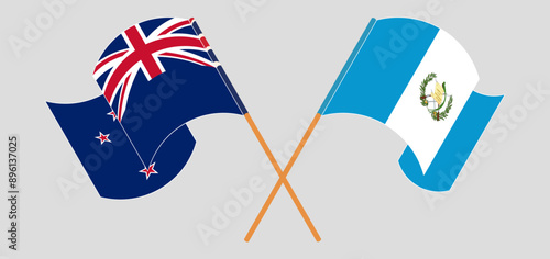Crossed and waving flags of New Zealand and Republic of Guatemala