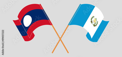 Crossed and waving flags of Laos and Republic of Guatemala