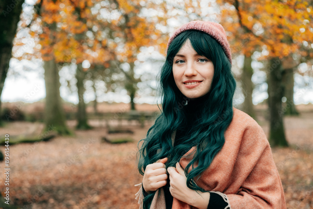 Woman in hat wrapped in warm Shawl Poncho enjoying autumn walk in forest with fall yellow leaves. Travel lifestyle. Feeling harmony, reunion with nature. Relaxing, personal fulfillment. Local travel Woman in hat wrapped in warm Shawl Poncho enjoying autumn walk in forest with fall yellow leaves. Travel lifestyle. Feeling harmony, reunion with nature. Relaxing, personal fulfillment. Local travel