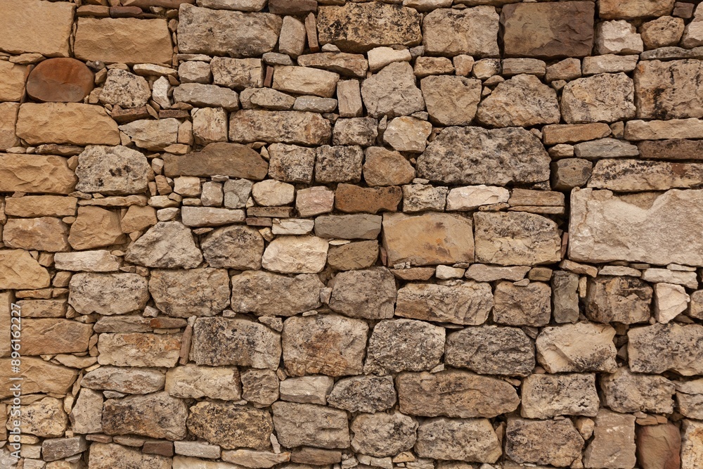 Fototapeta premium Old stone wall rough edges background