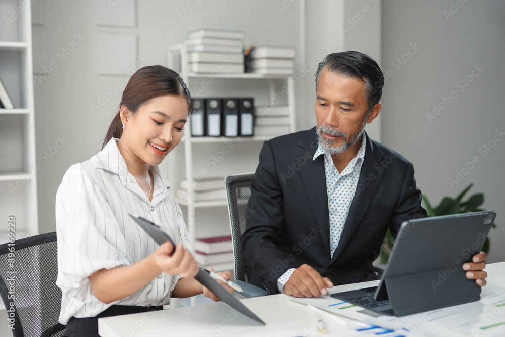 Professional team collaborating and problem solving in a business setting Professional team collaborating and problem solving in a business setting