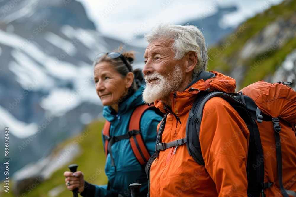 Active senior couple enjoying a scenic hike in nature during retirement Active senior couple enjoying a scenic hike in nature during retirement