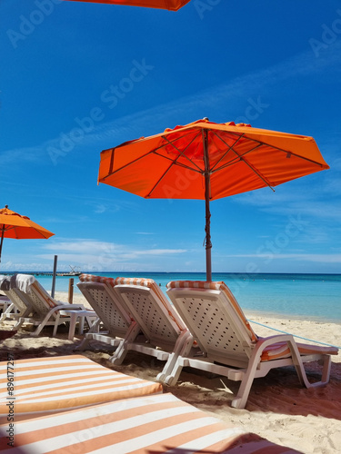 Wallpaper Mural Relaxing by the Blue Waters: Red Umbrella and Beach Chairs Torontodigital.ca