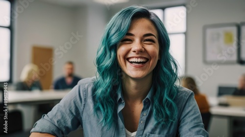 Female blur employee with teal hair, happy and laughing in team building office meeting