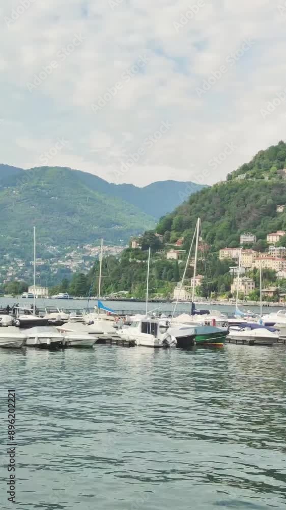 boats in the harbor, resort lake in the mountain italy boats in the harbor, resort lake in the mountain italy