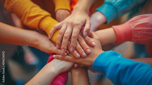 a group of people holding hands together in a circle