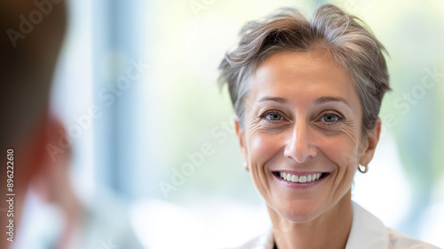 Confident Mature Businesswoman Smiling During Business Meeting